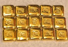 Vàng thế giới giảm 1% khi đồng USD tăng